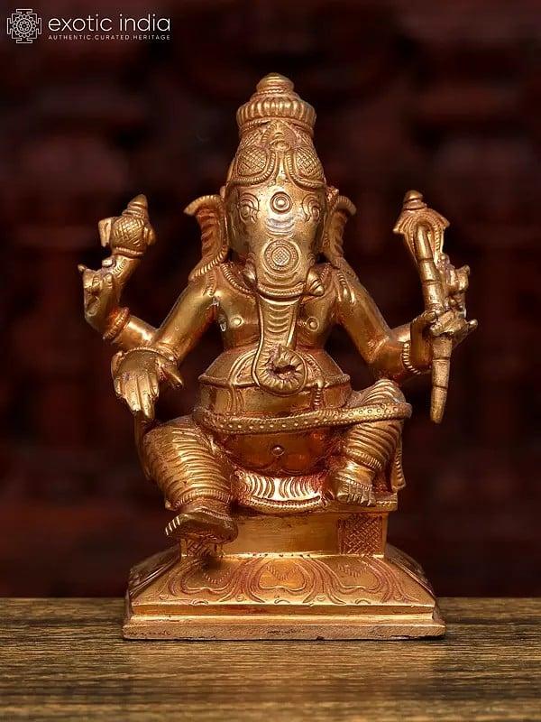 exotic india 5" Small Sitting Chaturbhuja Lord Ganesha | Bronze Statue 