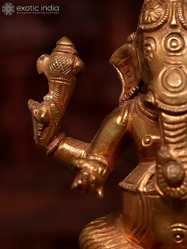 Exotic India 5" Small Sitting Four Armed Lord Ganesha | Bronze Statue 