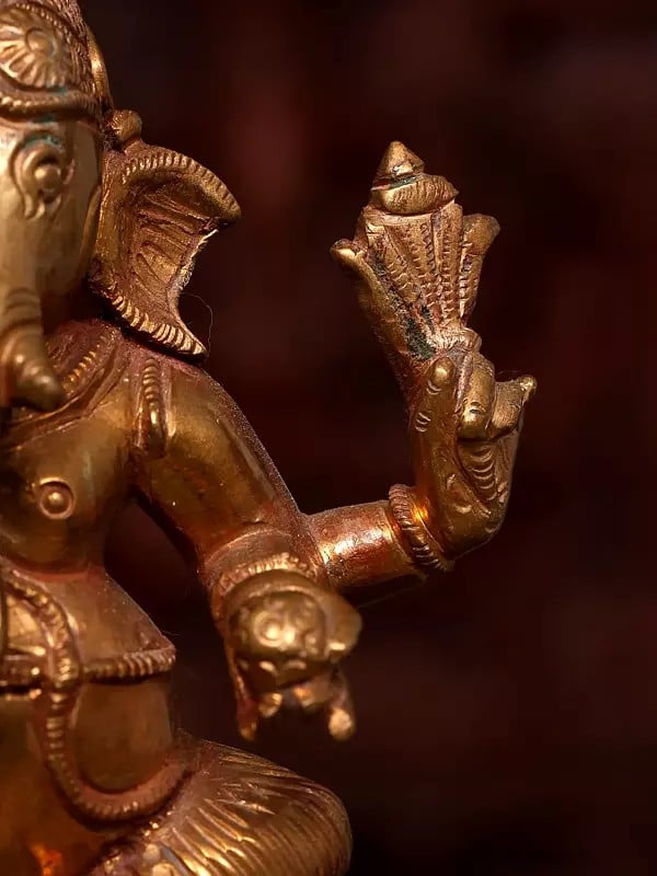 Exotic India 5" Small Sitting Four Armed Lord Ganesha | Bronze Statue 