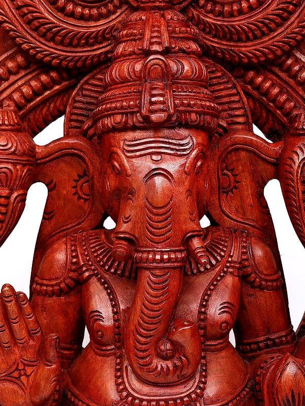 Exotic India 50" Large Blessing Lord Ganesha Seated On Mushak With Kirtimukha Prabhavali | Wood Carving 