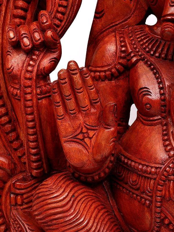 Exotic India 50" Large Blessing Lord Ganesha Seated On Mushak With Kirtimukha Prabhavali | Wood Carving 
