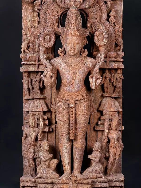 Exotic India 50" Large Standing Lord Surya Narayan Holding Two Lotuses | Khondalite Stone Sculpture | Made In Orissa 