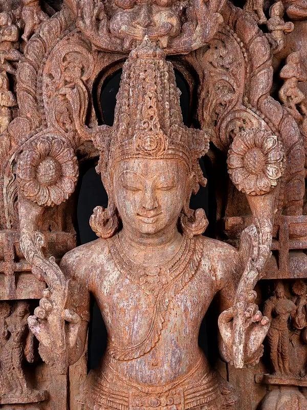 Exotic India 50" Large Standing Lord Surya Narayan Holding Two Lotuses | Khondalite Stone Sculpture | Made In Orissa 