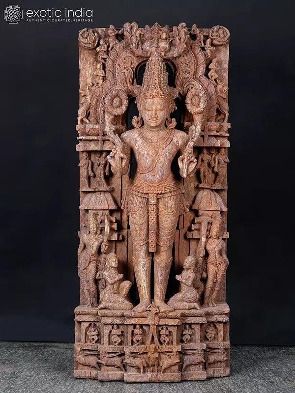 exotic india 50" Large Standing Lord Surya Narayan Holding Two Lotuses | Khondalite Stone Sculpture | Made In Orissa 