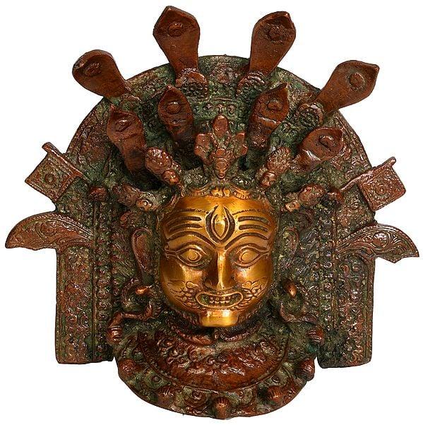 exotic india 6" Lord Bhairava and a Multitude of Snakes: Wall-Hanging Mask in Brass 