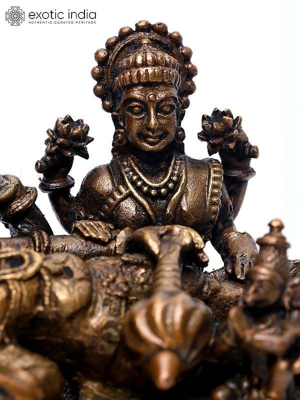 Exotic India 6" Small Shesha-Shayi Lord Vishnu With Devi Lakshmi And Garuda | Copper Statue 