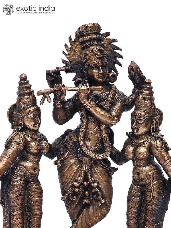 Exotic India 6" Small Standing Lord Krishna With Rukmini And Satyabhama | Copper Statue 