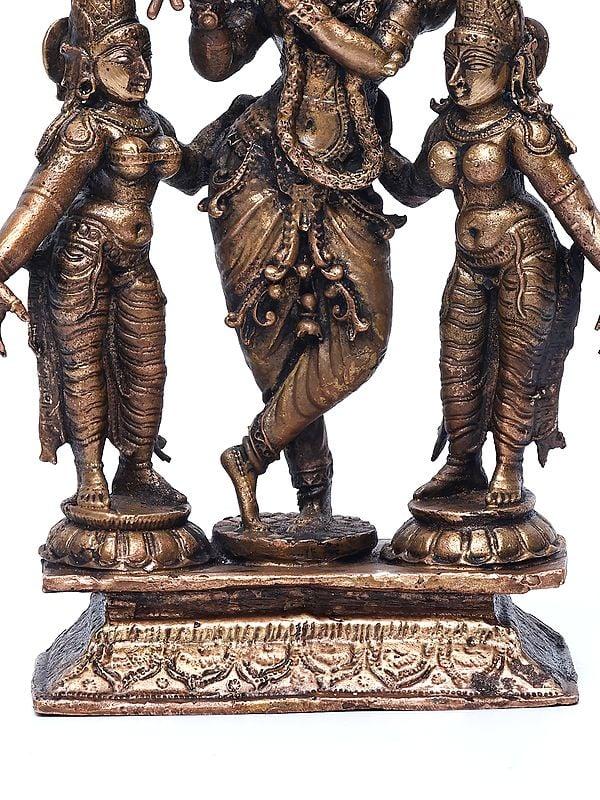 Exotic India 6" Small Standing Lord Krishna With Rukmini And Satyabhama | Copper Statue 