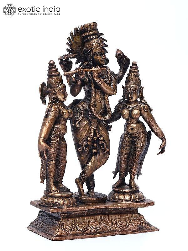 Exotic India 6" Small Standing Lord Krishna With Rukmini And Satyabhama | Copper Statue 