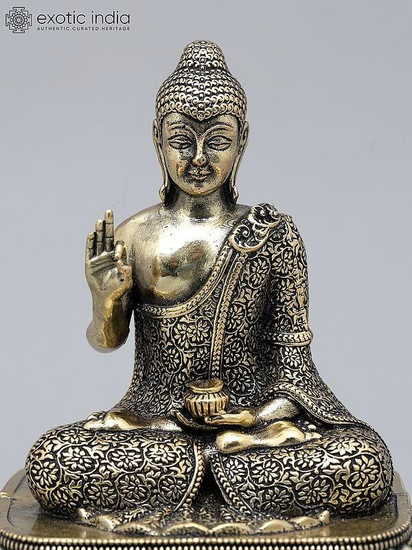 Exotic India 6" Small Superfine Lord Buddha Seated In Vitark Mudra On Wood Base | Brass Statue 