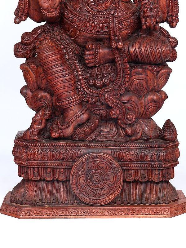 Exotic India 65" Large Four Armed Lord Ganesha Seated On Lotus | Wood Carving 