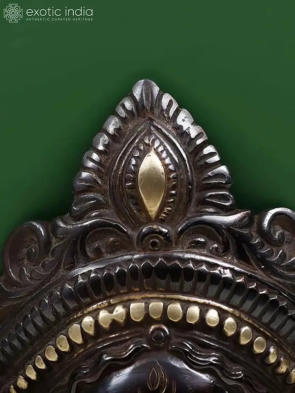 Exotic India 7" Serenity Of Kali Wall-Hanging Mask In Brass 
