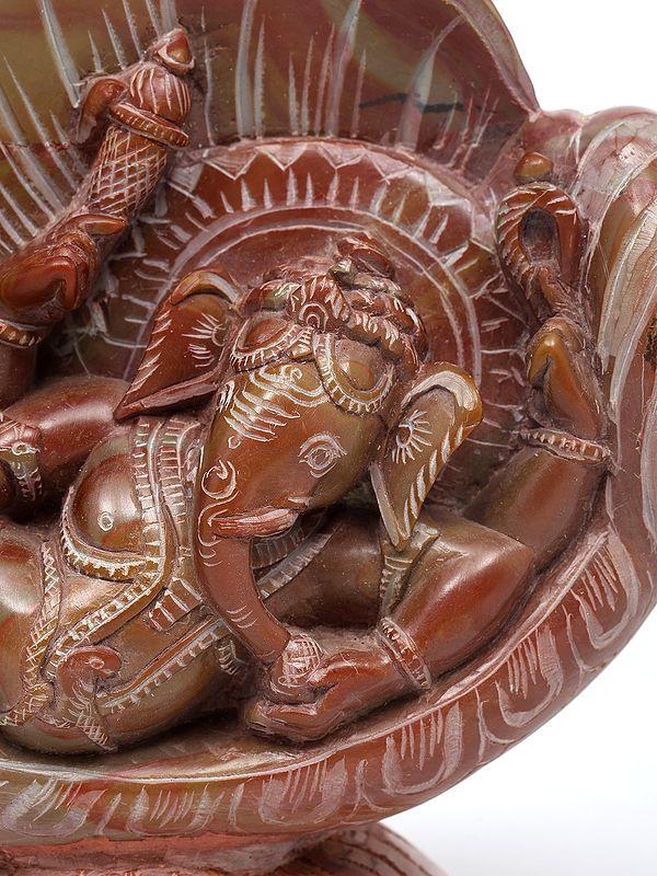 Exotic India 8" Relaxing Lord Ganesha Under The Conch | Relief Sculpture From Orissa 