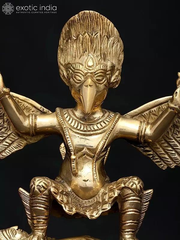 Exotic India 9" Garuda Subduing The Demon | Brass Statue 