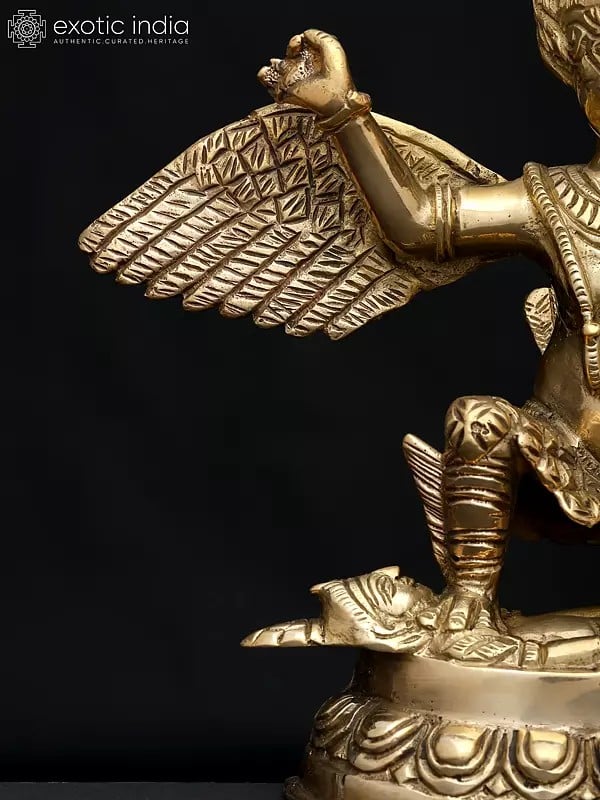 Exotic India 9" Garuda Subduing The Demon | Brass Statue 