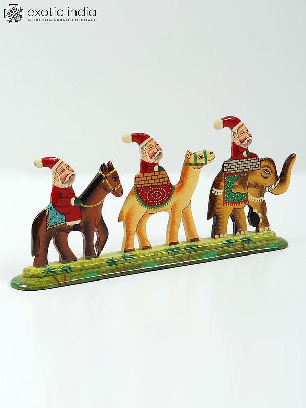 Exotic India 9" Hand Painted Wooden Santa Clauses Riding On Horse Camel And Elephant | Home Decor