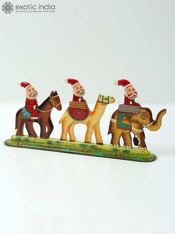 Exotic India 9" Hand Painted Wooden Santa Clauses Riding On Horse Camel And Elephant | Home Decor