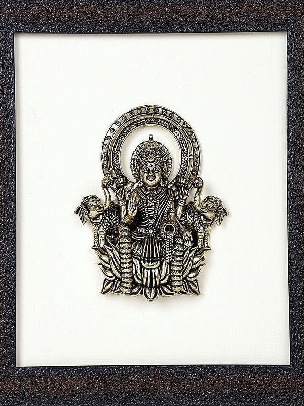 Exotic India 9" Superfine Goddess Gajalakshmi Wood Framed Brass Sculpture | Wall Hanging Statue 
