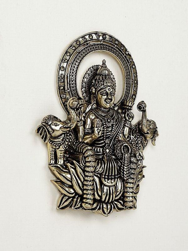Exotic India 9" Superfine Goddess Gajalakshmi Wood Framed Brass Sculpture | Wall Hanging Statue 