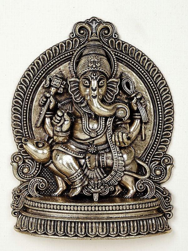 Exotic India 9" Superfine Lord Ganesha Seated On Mushak | Wood Framed Brass Sculpture | Wall Hanging Decor 