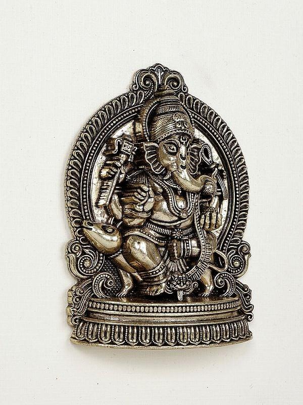 Exotic India 9" Superfine Lord Ganesha Seated On Mushak | Wood Framed Brass Sculpture | Wall Hanging Decor 