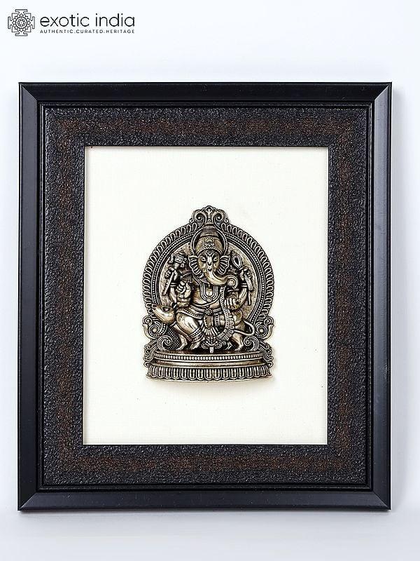 exotic india 9" Superfine Lord Ganesha Seated on Mushak | Wood Framed Brass Sculpture | Wall Hanging Decor 