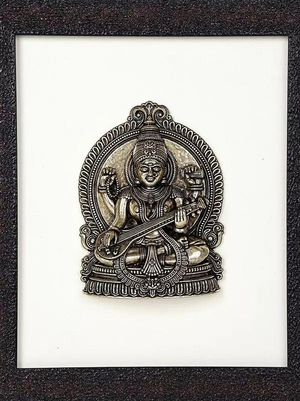 Exotic India 9" Superfine Sitting Goddess Saraswati | Wood Framed Brass Sculpture | Wall Hanging Decor 