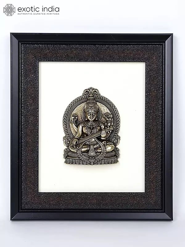 exotic india 9" Superfine Sitting Goddess Saraswati | Wood Framed Brass Sculpture | Wall Hanging Decor 