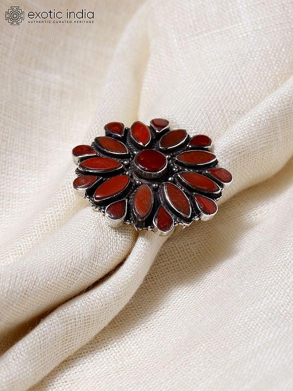 Exotic India Adjustable Floral Design Ring With Coral 