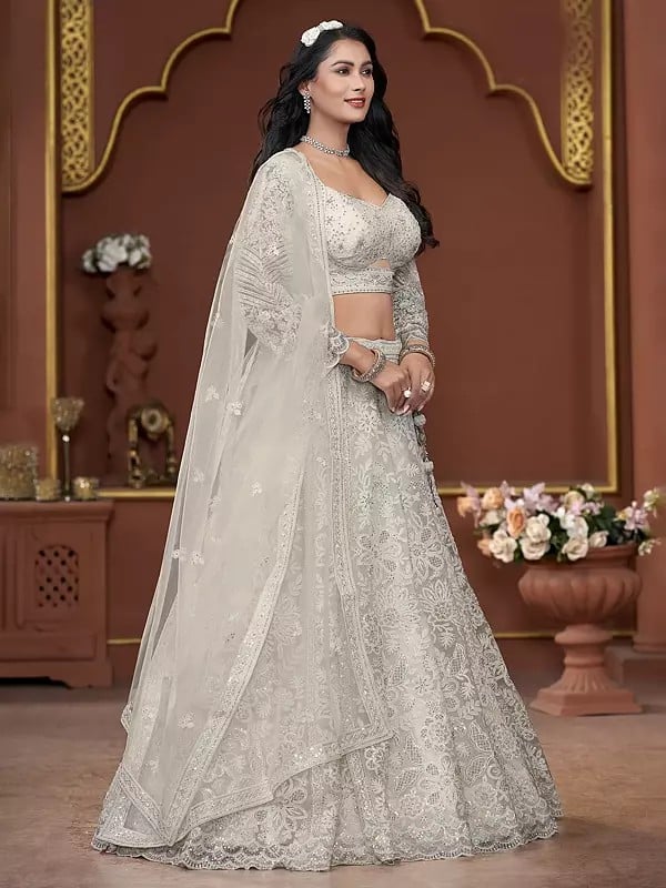 Exotic India All Over Zarkan Work Net Premium Net Floral Design Wedding Wear Lehenga Choli With Matching Dupatta 