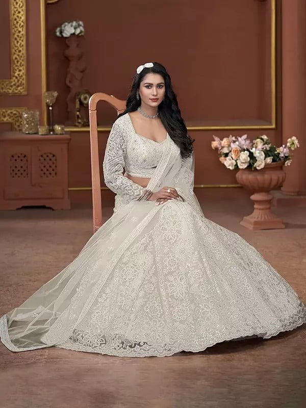 Exotic India All Over Zarkan Work Net Premium Net Floral Design Wedding Wear Lehenga Choli With Matching Dupatta 