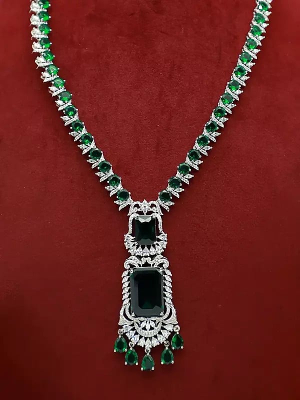 Exotic India Attractive Floral Design Stone Studded American Diamond Necklace Set With Matching Earrings
