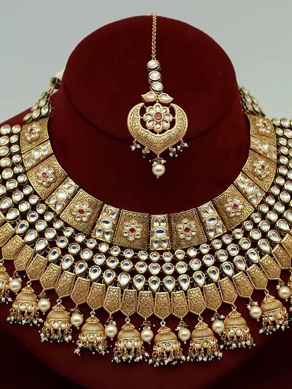 Exotic India Attractive Kundan Stone Necklace Set In Brass With Mangtika And Hanging Beads Earrings For Bride 