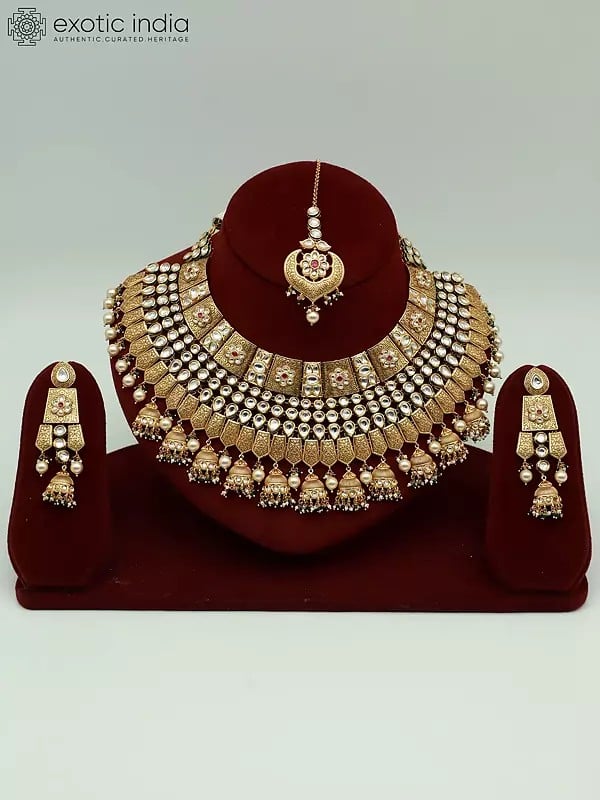 exotic india Attractive Kundan Stone Necklace Set In Brass With Mangtika And Hanging Beads Earrings For Bride