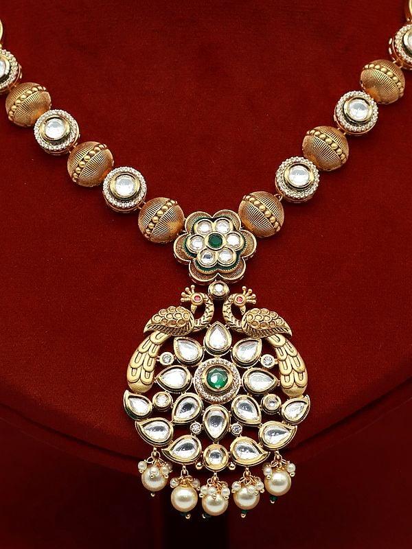 Exotic India Attractive Kundan Studded Necklace Set With Peacock Pendant And Earrings 