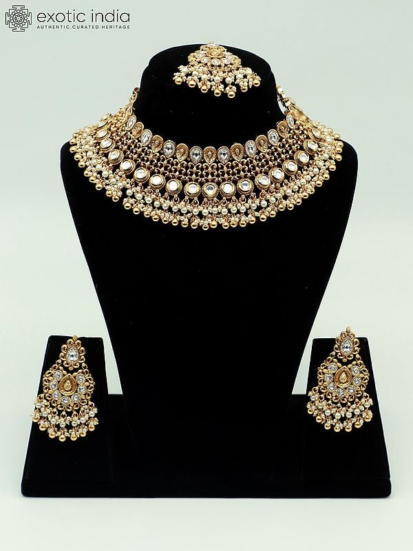 exotic india Attractive Stone Studded And Beaded Choker Necklace With Matching Earrings And Mangtika