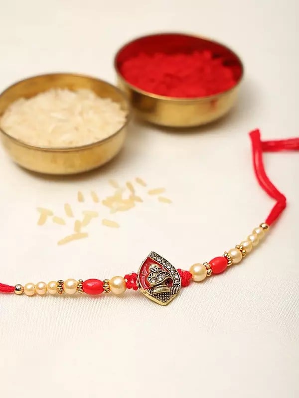Exotic India Auspicious Shivling Rakhi With Red Thread And Stone-Beads Work 