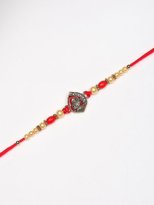 exotic india Auspicious Shivling Rakhi with Red Thread and Stone-Beads work 