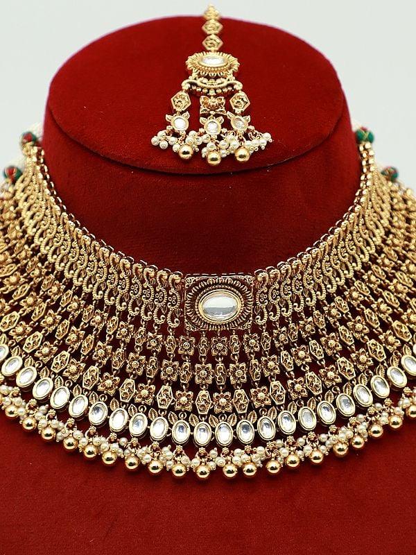 Exotic India Beaded And Stone Studded Attractive Choker Necklace With Matching Earrings And Mangtika