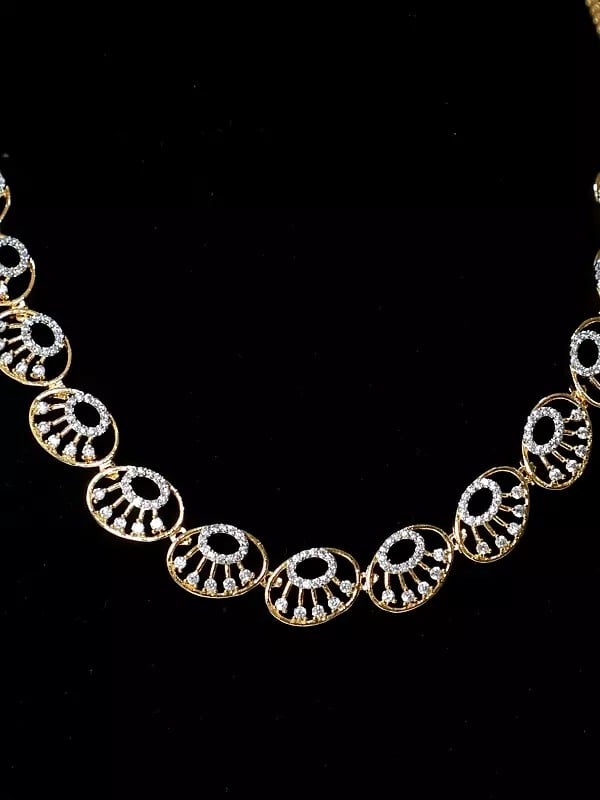 Exotic India Beautiful Design Embellished Stone Studded American Diamond Necklace Set With Earrings