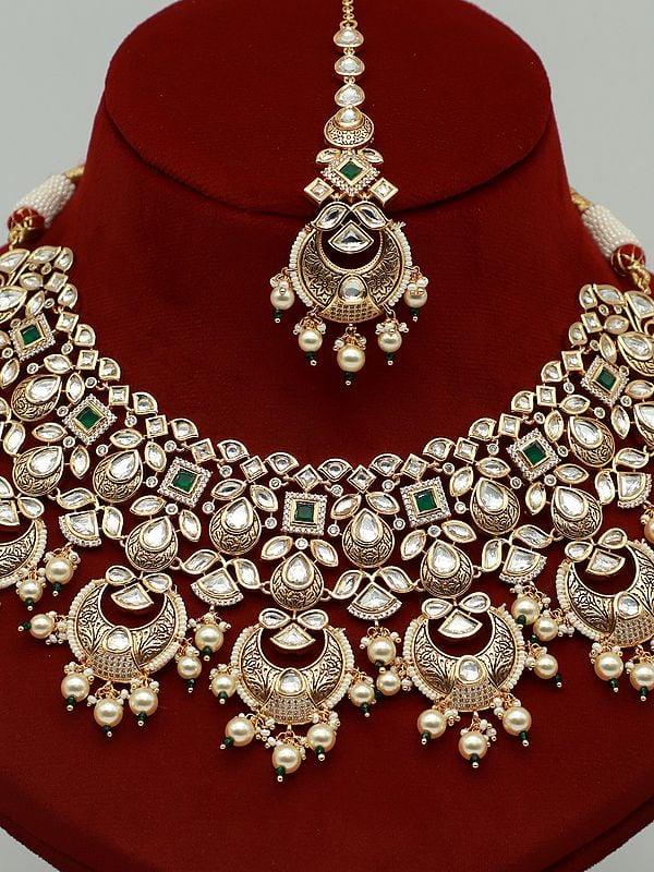 Exotic India Beautiful Kundan Necklace Set With Hanging Pearl And Earrings 