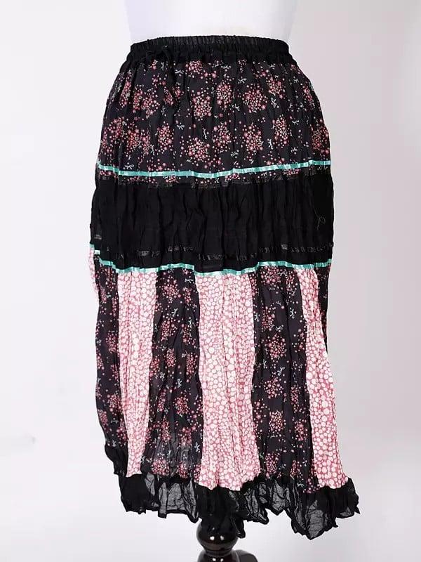 Exotic India Black-Olive Printed Elastic Long Skirt With Ruffle Border 