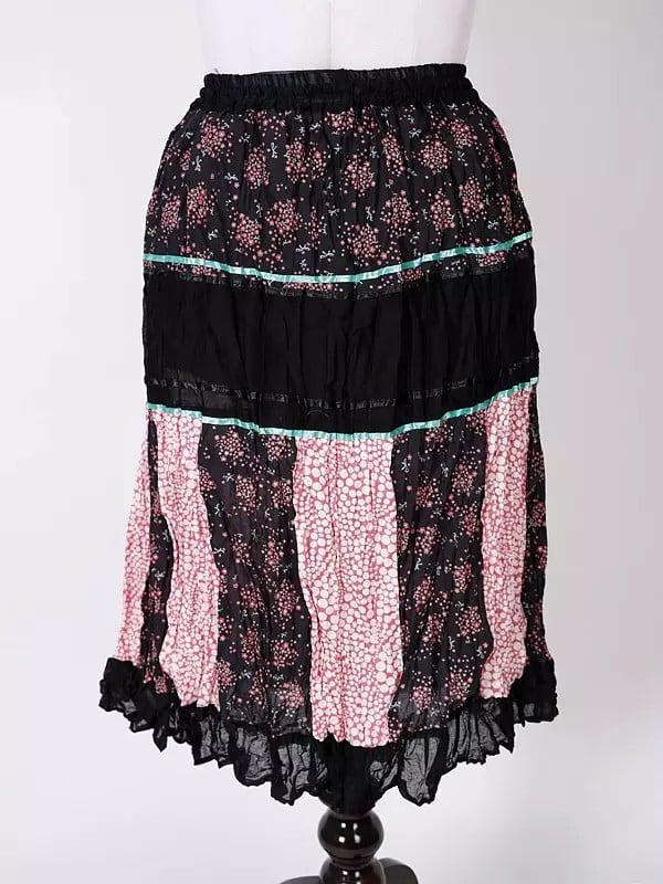 Exotic India Black-Olive Printed Elastic Long Skirt With Ruffle Border 