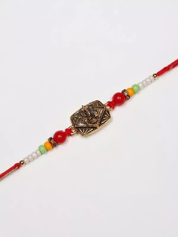 exotic india Blessing Lord Ganesha Rakhi with Beads 