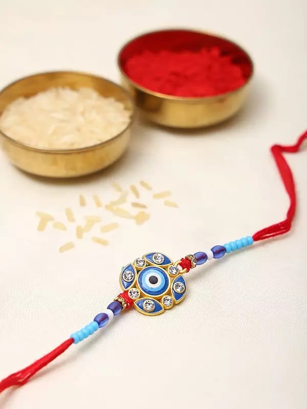 Exotic India Blue Evil Eye Rakhi With Studded Stone For Protection From Negative Energy 