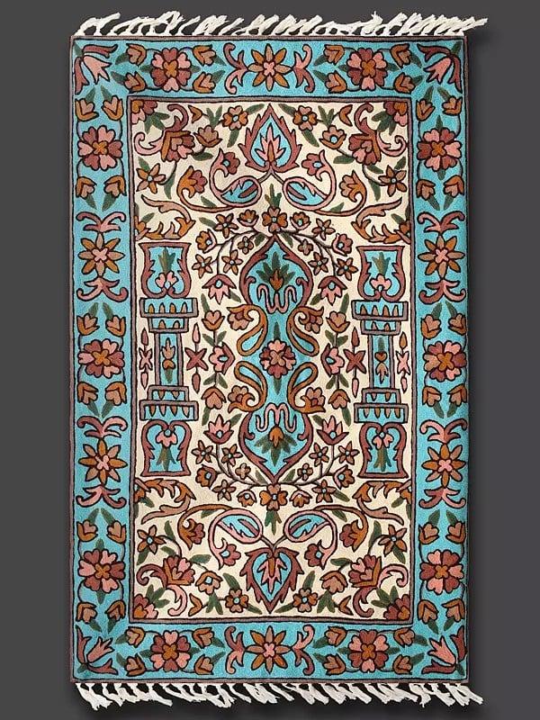 Exotic India Blue Grotto And Alabaster Gleam Cashmere Wool Chain Stitched Embroidered Carpet With Tassels And Traditional Motifs From Kashmir 