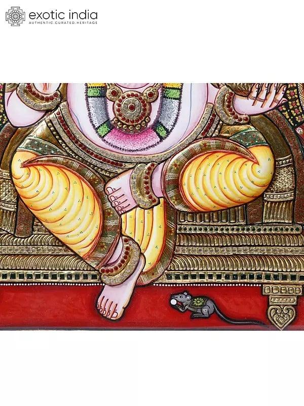 Exotic India Chaturbhuja Lord Ganesha Seated On Throne | Framed Tanjore Painting | 24 Karat Gold Work 