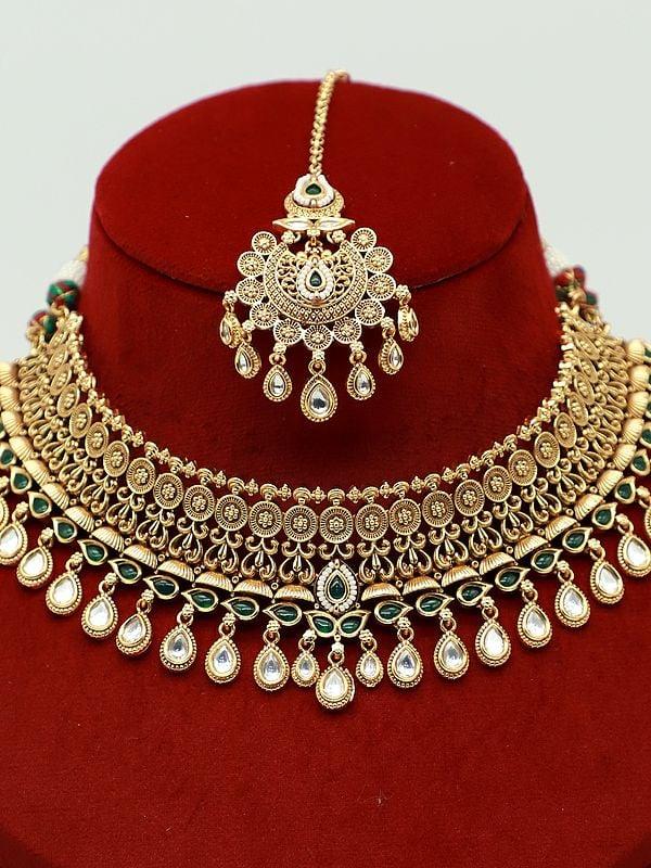 Exotic India Choker Attractive Stone Studded Necklace With Matching Earrings And Mangtika