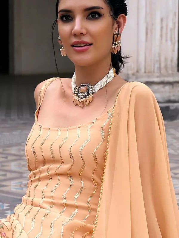 Exotic India Deep-Peach Attractive Zig-Zag Pattern Sequins And Embroidery Work Sleeveless Kurti With Sharara