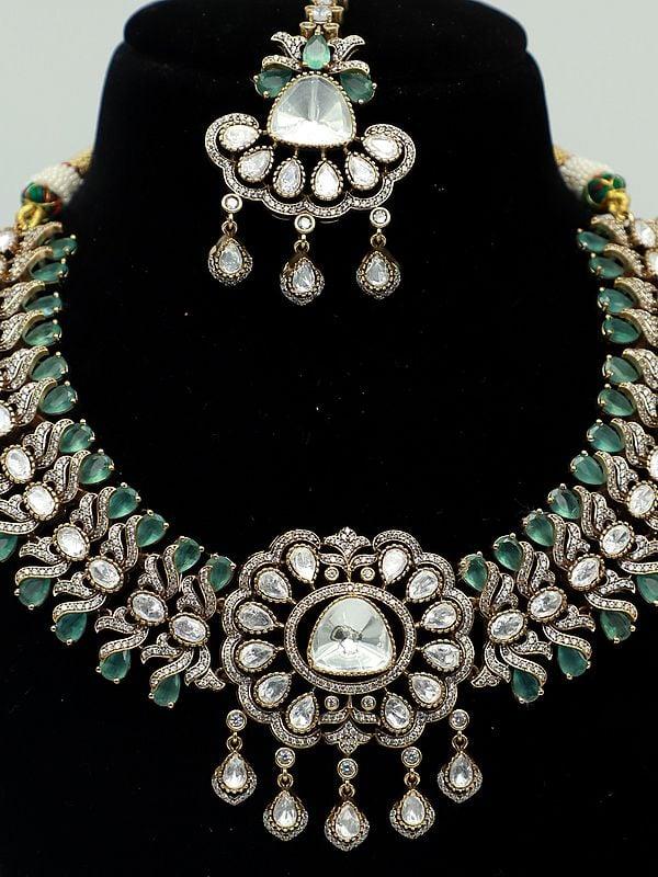 Exotic India Designer Moissanite Kundan Set For Bride With Earrings And Mangtika 